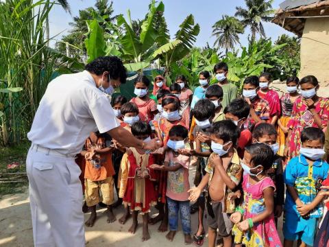 Service-Service-Camp-for-awareness-and-distribution-of-sanitizer-and-masks-in-Sagar-Island-West-bangal